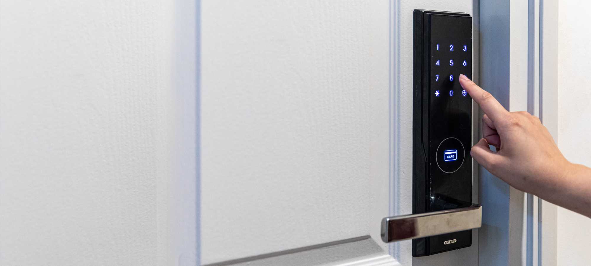 Woman unlocking front door using a keyless digital lock