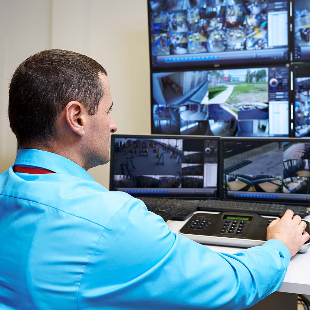 Security professional monitoring a CCTV feeds 24/7